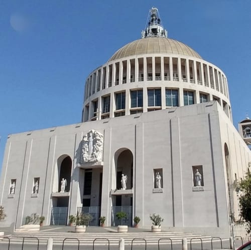 Modern white dome cathedral with ornate facade near Cinecittà, Rome - view from Claudia Apartments