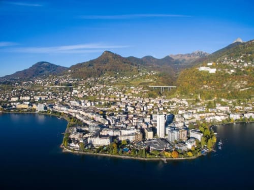 Aerial view of Montreux on Lake Geneva with Alpine mountains and waterfront buildings