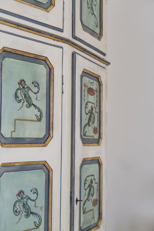 Decorative framed panels with Asian-inspired artwork and botanical motifs adorning the walls of Villa Stecchini Resort in