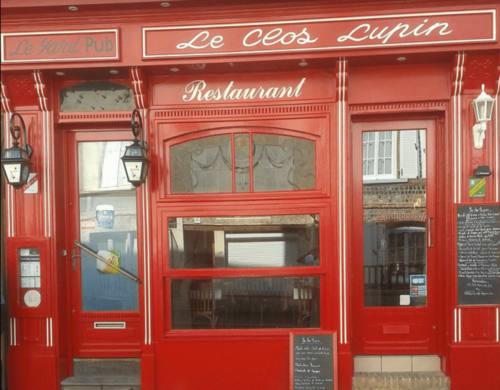 Le Céos Lupin restaurant storefront with bright red facade in Ecrainville, France