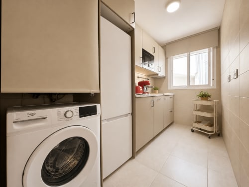 Modern laundry room with Beko washing machine in Aroma de Azahar apartment at Living Sur, Sanlúcar de Barrameda