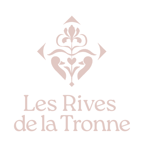 Les Rives de la Tronne luxury hotel logo with ornate fleur-de-lis emblem, Mer France