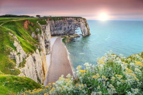 Dramatic white chalk cliffs and natural arch at Étretat, Normandy, near Clos Céleste B&B in Ecrainville