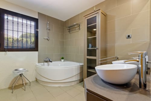 Luxury villa bathroom in Benalmádena with corner bathtub, vessel sink, and large shower at Ayma Villa Cielo y Mar