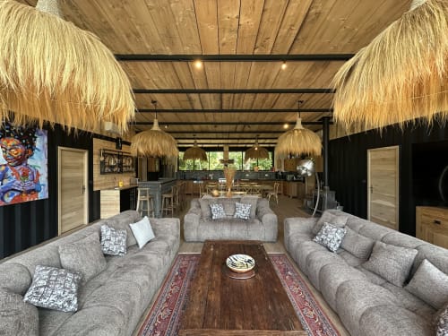 Spacious living room with gray seating and pendant lights in Chez Babeth cottage at Le Village Du Moulin, Sizun