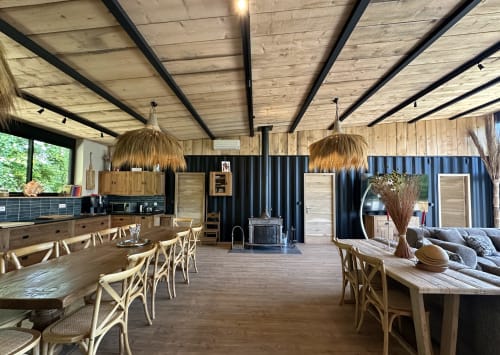 Spacious open-plan cottage at Le Village Du Moulin in Sizun with kitchen, dining area, and living room featuring wooden beams