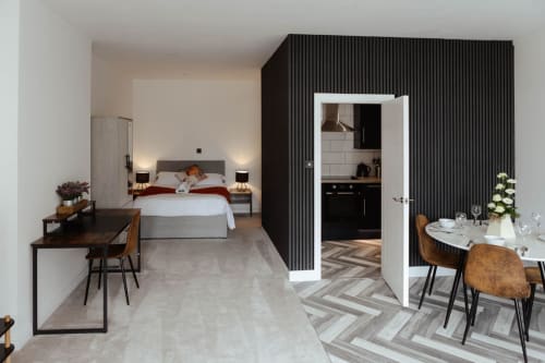 Spacious modern studio apartment at JS Apartments in Blackburn with bedroom, kitchenette, dining area and work desk