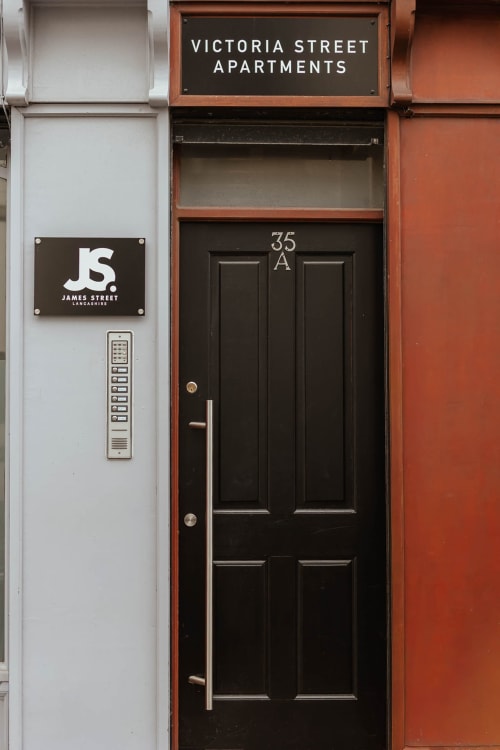 Victoria Street Apartments entrance at 35A in Blackburn, JS Apartments Collection property with black door and intercom