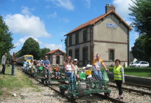 Guests enjoying a pedal-powered railway experience at Clos Céleste near Etretat, Normandy