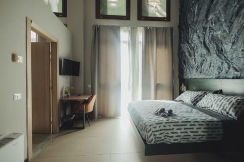 Camera da letto Deluxe spaziosa presso Oltre Exclusive a Palermo con vista città, arredamento moderno e scrivania