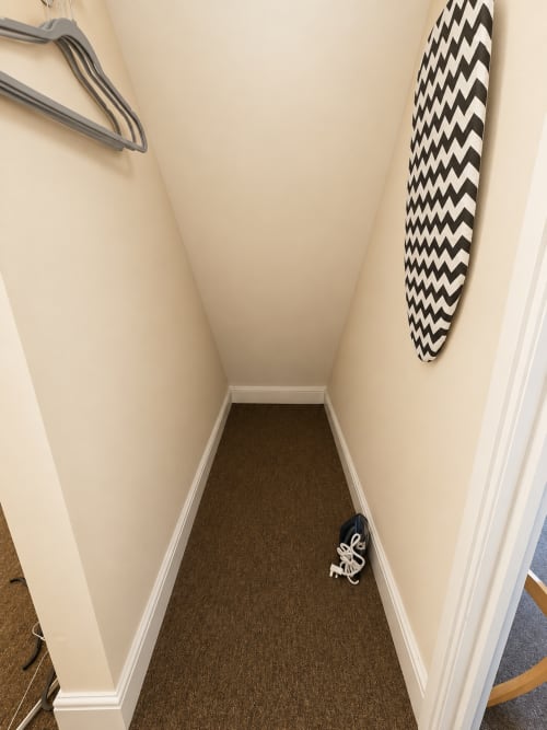 Narrow hallway in Superior Double Room at The Cornerhouse Somerset hotel with brown carpeting and cream walls