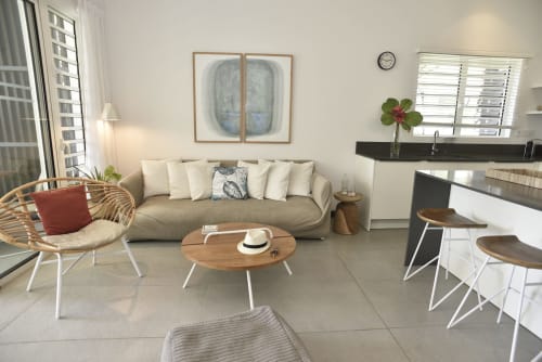 Modern living room in O'Biches Premium Apartment, Trou-aux-Biches with beige sofa, wooden table, and garden view