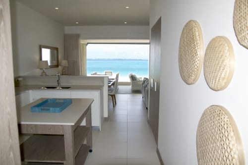 Modern beachfront luxury apartment kitchen with sea view balcony at Unik Properties, Pointe d'Esny, Mauritius