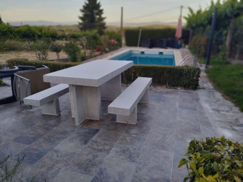 Stone picnic table with benches on patio overlooking pool at Casa Pedro villa in Pantón, Galicia