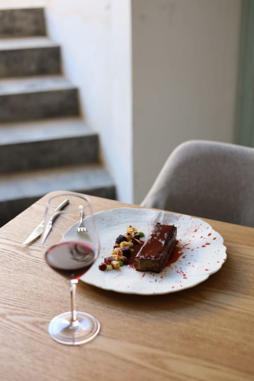 Elegant plated chocolate dessert with wine at Hotel Fragile, Ciutadella de Menorca