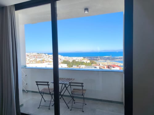 Balcony view from SAMYAflat apartment in Tangier with panoramic Mediterranean Sea and city skyline