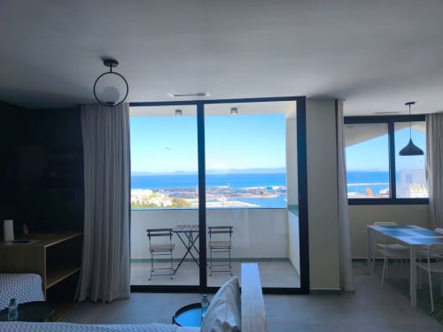 Bright apartment balcony overlooking Tangier Bay and coastline at SAMYAflat YaYaCaSa vert