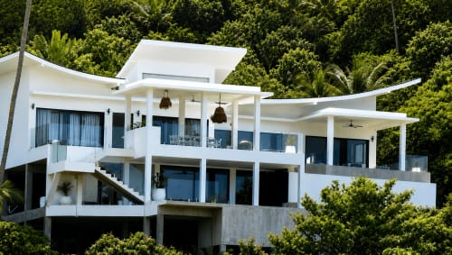 Modern white villa at Indigo Villa Samui, Ko Samui, with multi-level terraces overlooking tropical gardens