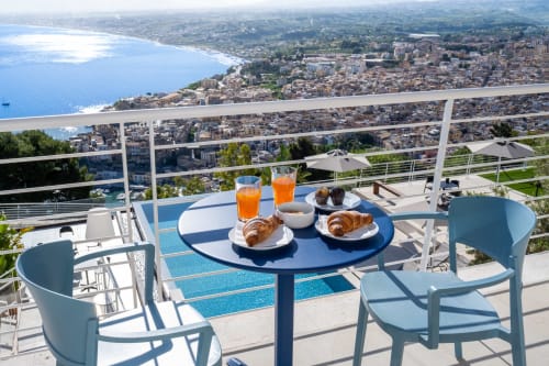 Breakfast on terrace at Hotel Belvedere Resort overlooking Castellammare del Golfo bay with sea views