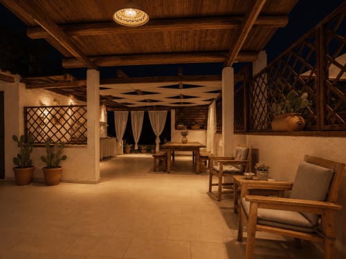 Terrazza della San Basilio Guest House a Ispica con travi in legno, sedute confortevoli e illuminazione ambientale notturna