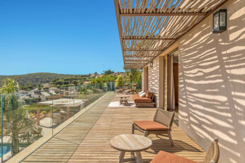 Villa Luna terrace at Jc Conciergerie, Bandol with sea views, wooden deck, pergola shade, and loungers