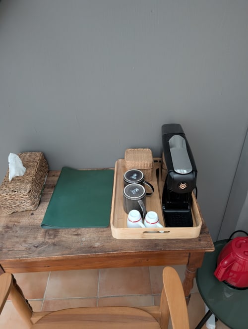 Coffee and tea service station in Xérès room at Domaine de Pelican, Gignac with mirror and amenities