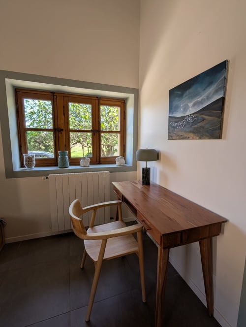 Modern home office at Domaine de Pelican villa in Gignac with wooden desk, mid-century chair, and garden views through large