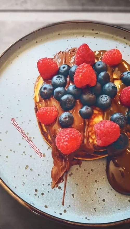 Chocolate tart with fresh raspberries and blueberries at Clos De La Gourmandière restaurant in Saint-Lothain