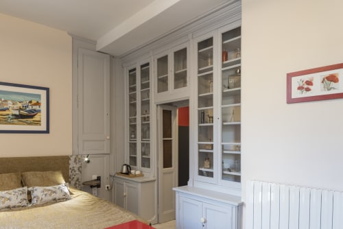 Chambre Caducée bedroom at Le Clos Saint Maurin B&B in Saint Maurin, France, featuring antique furniture and garden views