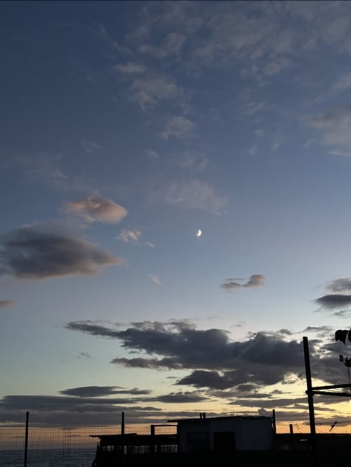 Crescent moon and clouds at sunset over the Mediterranean Sea from Apartamentos Turísticos Axarent balcony, Almayate Alto