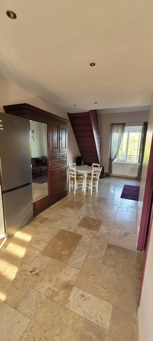 Family suite kitchen and dining area at Villa Varco, Auxonne, with modern appliances and tile flooring