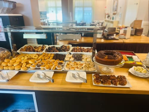 Hotel breakfast buffet display at Verdi SRL in Jesolo with pastries, croissants, and baked goods