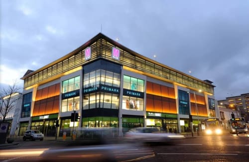 Primark store exterior in Blackburn with illuminated signage and modern architecture at dusk