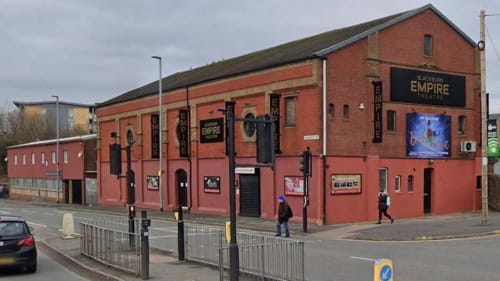 Blackburn Empire Theatre historic red brick building with signage on street corner