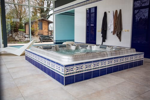 Luxurious hot tub with decorative blue tilework at Villa Bianca, a Belgian bed and breakfast retreat