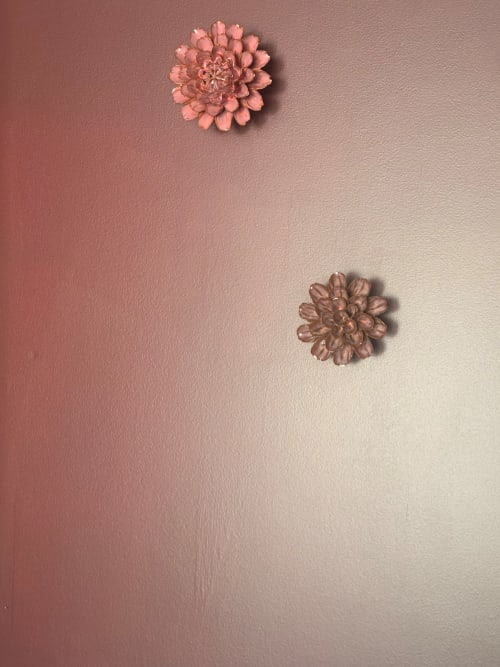 Two pink dahlia flowers on gradient pink wall in An heol penthouse at Maisons Valmer, Le Havre