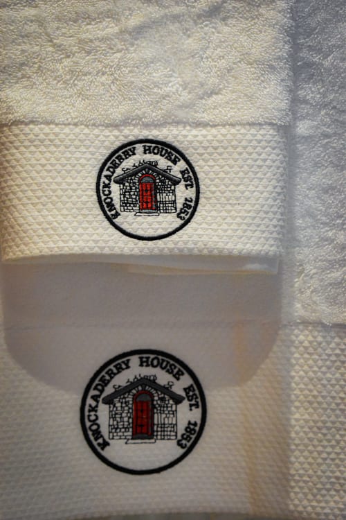 Knockaderry House towels with embroidered logo featuring red door design, Ennis B&B