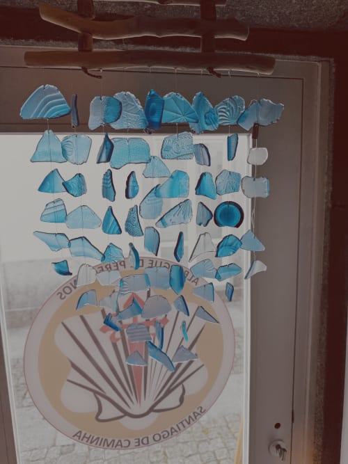 Hanging paper fish mobile decoration at Albergue Santiago de Caminha hostel in Caminha, Portugal