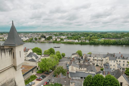 Chateau Haute Roche overlooking Oudon town and Loire River with historic architecture