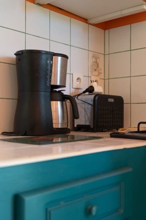 Kitchen counter with coffee maker and toaster in Guadeloupe gîte with pool view