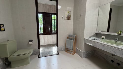 Modern bathroom at Villa Estrella Polar with toilet, vanity sink, shower, in Tahiche, Las Palmas