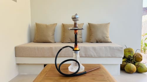 Luxury villa lounge at Oasis Dune Villas with shisha, cushioned seating, and tropical fruits on wooden table