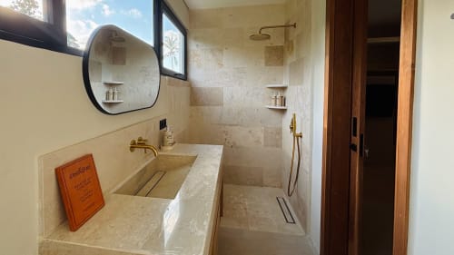 Luxury bathroom at Oasis Dune Villas with marble shower, dual vanity sink, and modern fixtures in Lombok