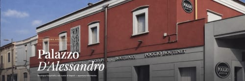 Palazzo D'Alessandro boutique hotel exterior in Anacapri with red and gray facade and Poggio signage