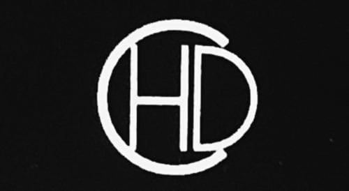 White HD logo on black background for Charm Discovery Experiences, a Lisbon BnB apartment