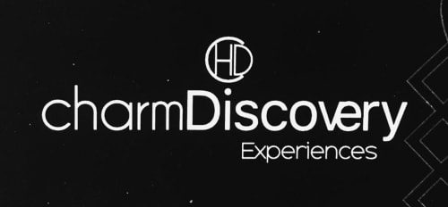 Charm Discovery Experiences logo - Lisbon boutique BnB brand featuring HD monogram and elegant typography on dark background