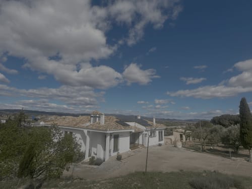 White cottage Casa Rural Finca El Olivar in Las Cuevas with terrace, pool views, mountains and olive trees