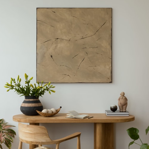 Espace de travail épuré à La Grange Aux Étangs avec bureau en bois, plante en pot et œuvre abstraite