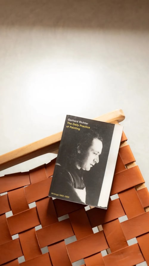 Gerhard Richter book on orange brick ledge at Hotel Fragile, Ciutadella de Menorca