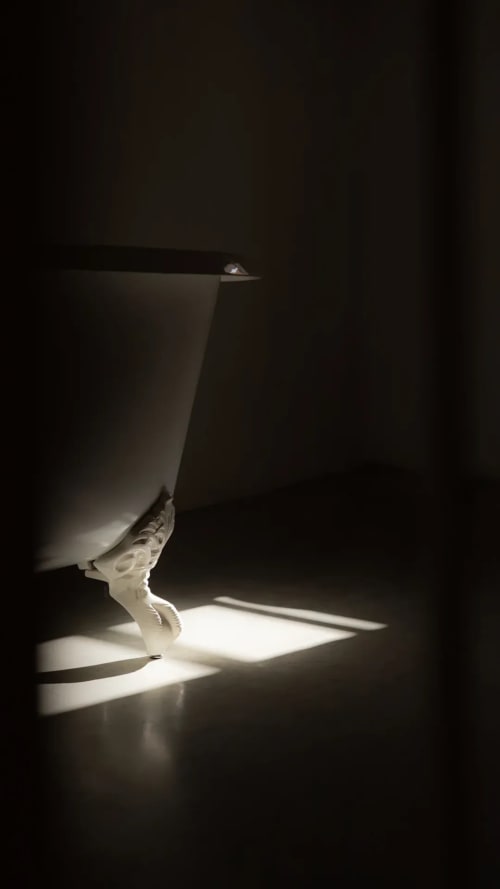 Minimalist bathroom fixture with dramatic lighting at Hotel Fragile, Ciutadella de Menorca